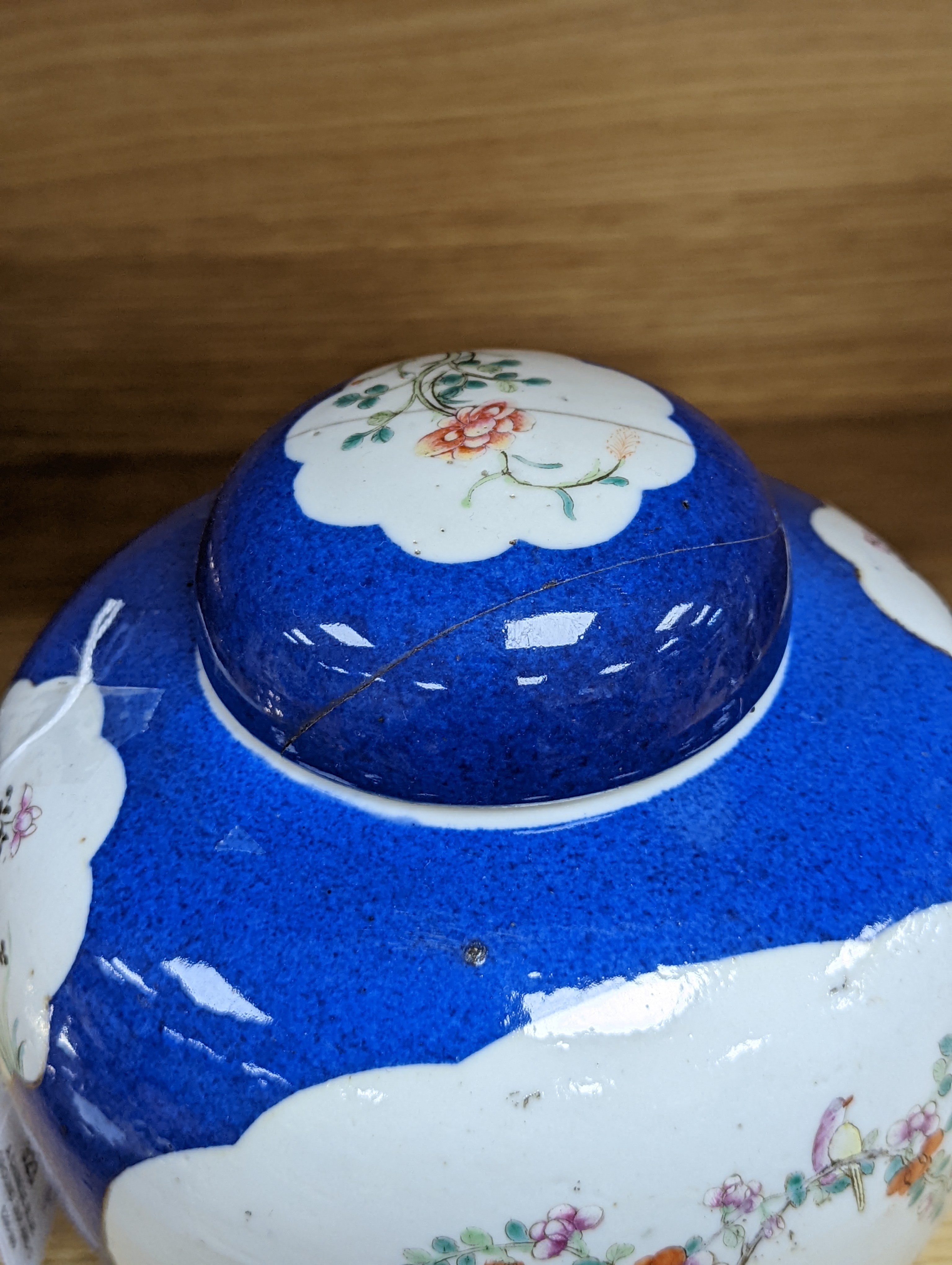 A Chinese blue ground jar and cover, 19th century, Qianlong mark to base, 20cm high